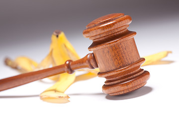 Image showing Gavel and Banana Peel on Gradated Background