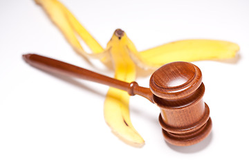 Image showing Gavel and Banana Peel on Gradated Background