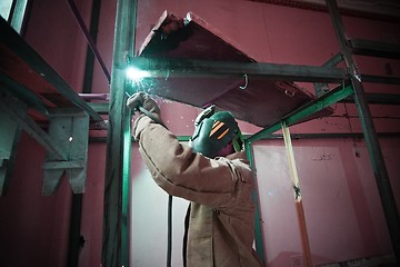 Image showing Welder work with metal construction