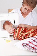 Image showing Elderly woman sewing