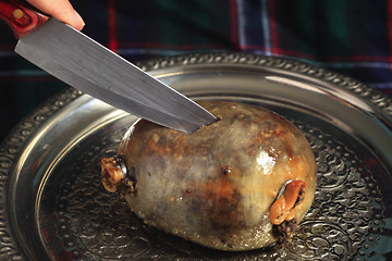 Image showing Cutting the haggis