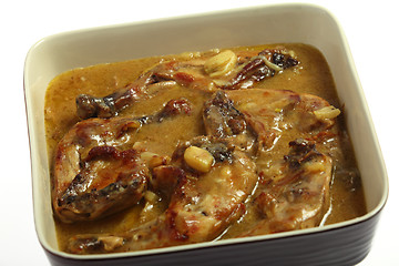 Image showing Chicken legs cooking in lemon and garlic sauce