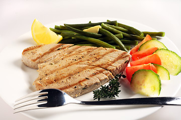 Image showing Grilled tuna meal with fork