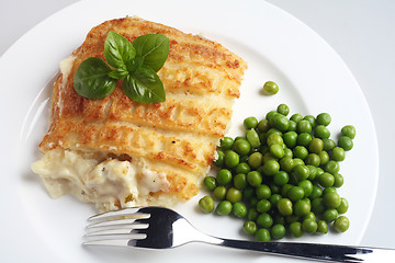 Image showing Fish and potato pie with peas and fork