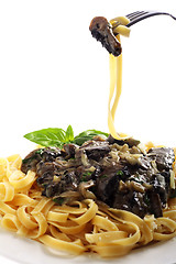 Image showing Fettuccini and mushroom on a fork