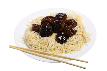 Image showing Sweet and sour meatballs and chopsticks