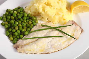 Image showing Baked fish, lemon and vegetables