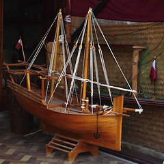 Image showing Model dhow and Qatari flag