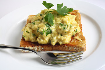 Image showing Scrambled egg with parsley on toast