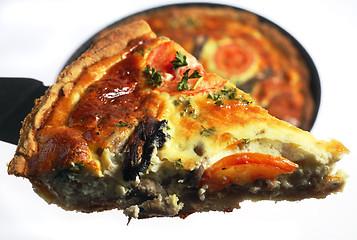 Image showing Slice of quiche being lifted from a baking pan