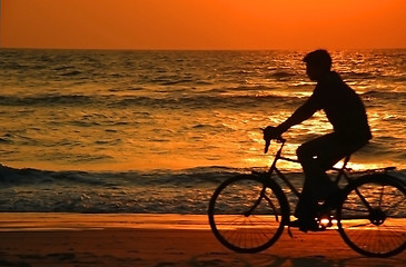 Image showing Cycling At Sunset On The Beach