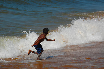 Image showing Running Away from the Wave