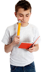 Image showing Child with notebook and pencil