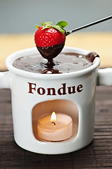 Image showing Strawberry dipped in chocolate fondue