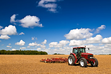 Image showing Tractor in plowed field