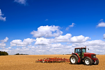 Image showing Tractor in plowed field