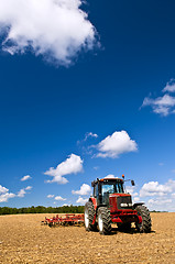 Image showing Tractor in plowed field