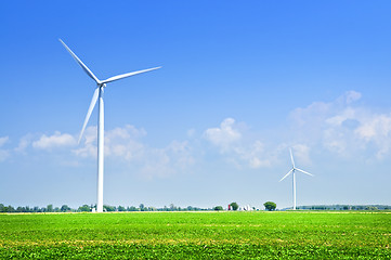 Image showing Wind turbines in field