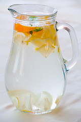 Image showing Pitcher with water and fruits