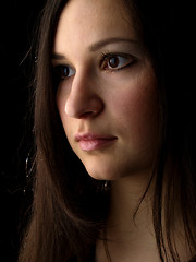 Image showing Young brunette on black