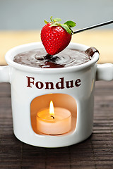 Image showing Strawberry dipped in chocolate fondue