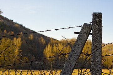 Image showing fence with barbed wire in forest mountains