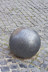 Image showing iron ball on cobblestone