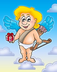 Image showing Cupid with gift on blue sky