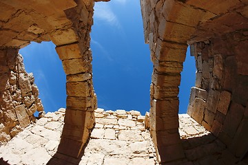 Image showing Blue sky seen through the holes in the roof of ruined ancient building