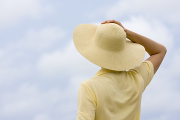 Image showing Woman with hat in front of sky