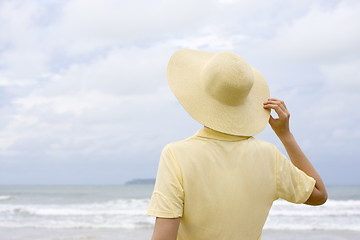 Image showing Woman with hat on a beach