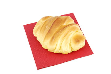 Image showing One fresh croissant on a red napkin