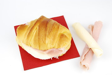 Image showing Cheese and ham croissant on a red napkin