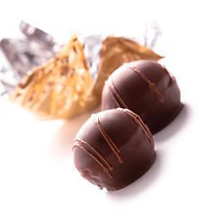 Image showing two foil opened sweets