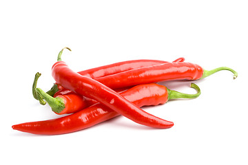 Image showing four red chili peppers