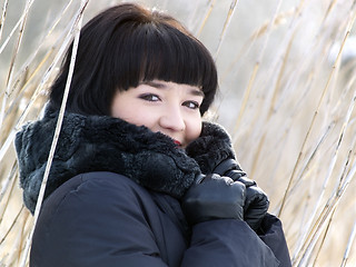 Image showing Winter girl in reed outdoors