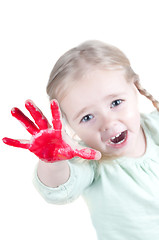 Image showing Little girl playing with colors