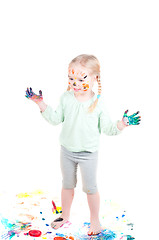 Image showing Little girl playing with colors