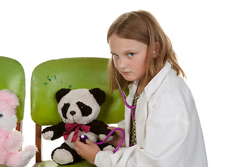 Image showing girl playing doctor with her toys