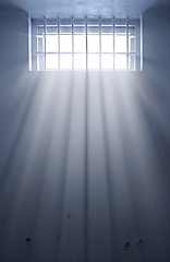 Image showing cold prison cell with sunshine through window