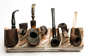 Image showing pipe collection on modern pipe rack 
