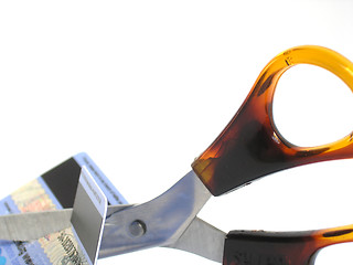 Image showing Scissors cutting through unwanted credit card.