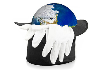 Image showing Black magic hat and gloves with earth