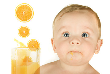 Image showing baby boy with orange juice