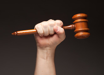 Image showing Male Fist Holding Wooden Gavel