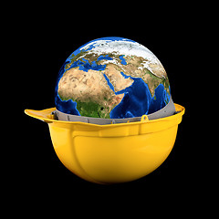 Image showing Yellow helmet with earth planet