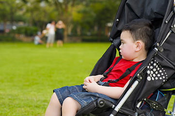 Image showing boy in baby buggy