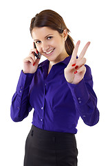 Image showing  woman with victory gesture and mobile phone