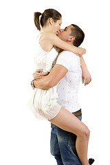 Image showing young man holding his girlfriend in the air