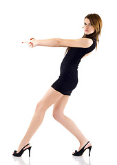 Image showing seminude girl aiming  with two hands